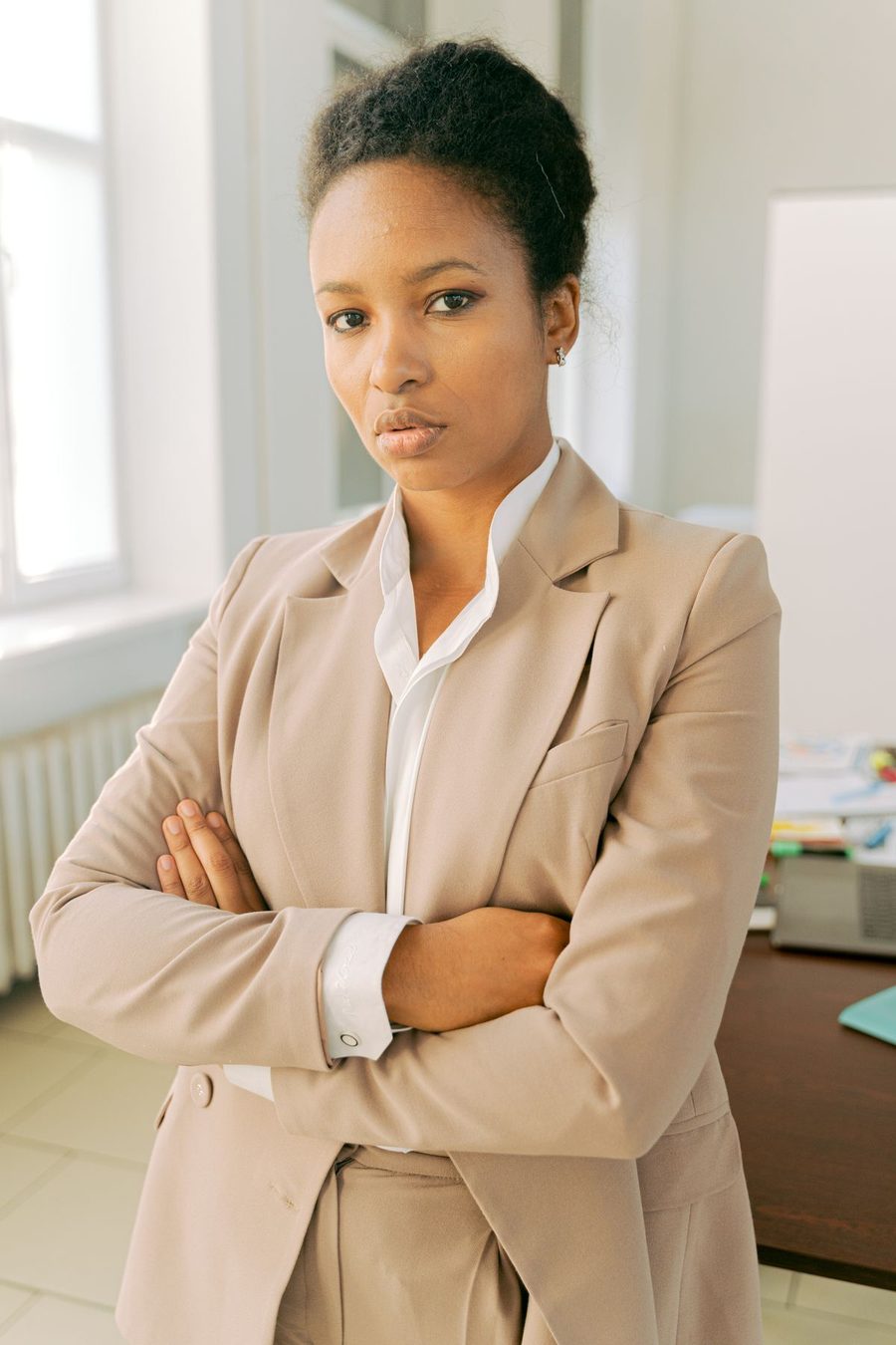A confident Black businesswoman in a professional setting.