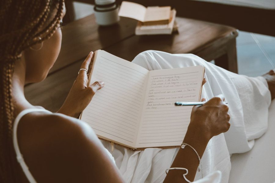 A woman journaling in a quiet moment.