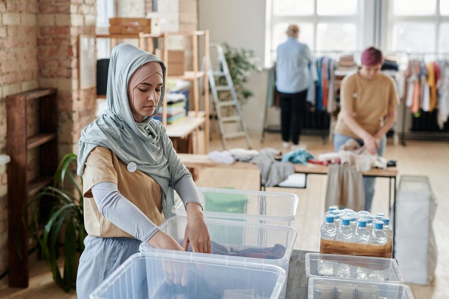 Volunteers sorting donated clothing at a community center.