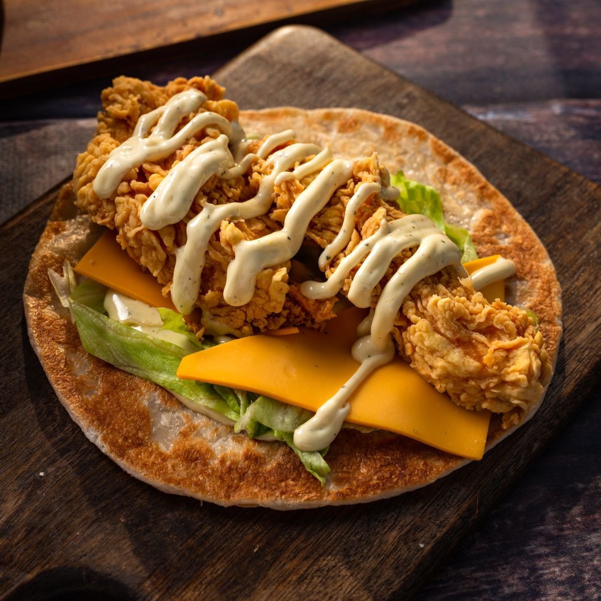 Chicken wrap with lettuce and creamy dressing