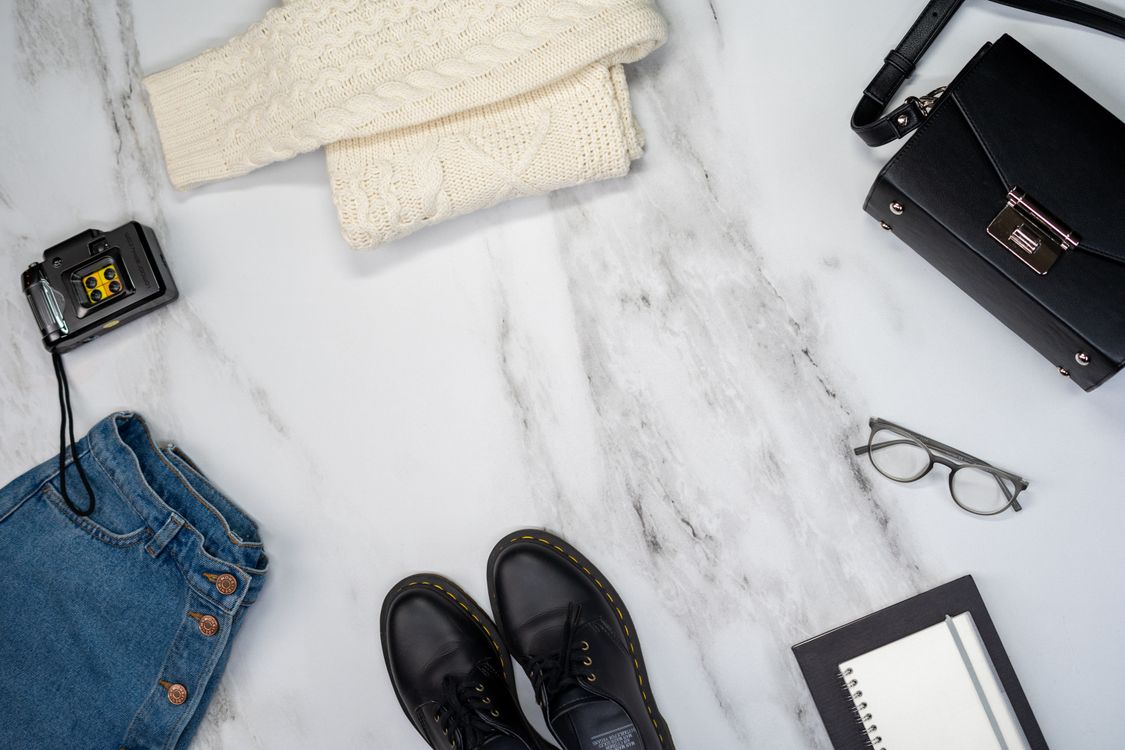Fashion flat lay with clothing and accessories, no person